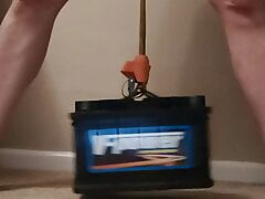 Lifting a car battery with my balls