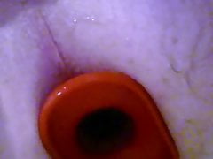 Big red anal plug pops out of hole
