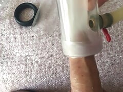 Milking machine sucks big cock while standing
