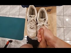 Young teen jerking off on his leather shoes while standing