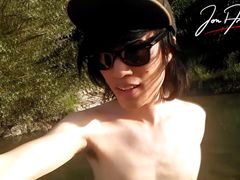 Jon Arteen slim Asian twink boy dancing musical strip-tease on beach smiling showing full pubes outdoor gay porn shoes