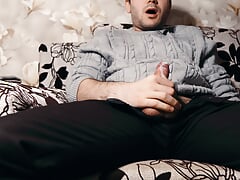 The guy watches porn and masturbates. Ruined orgasm 4 times and loud moans during a cumshot. 4K