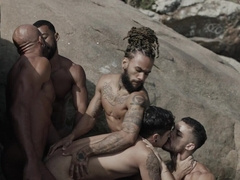 Appealing men fuck by the rocks in outdoor threesome and share great details