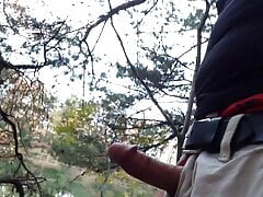 Public jerking-off in the woods and cumming by the water.