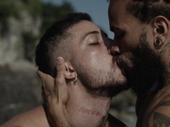 Appealing men make out in outdoor group sex by the beach