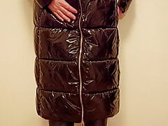 Crossdresser Tranny in Latex coat, and red dress Masturbate.