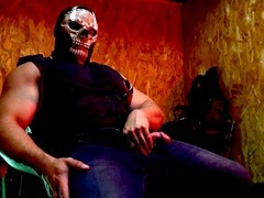 Buff guy in uniform giving himself a handjob with his massive cock