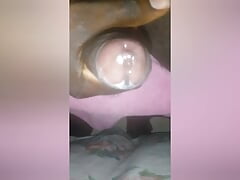 Guy gently stroking his black cock until he cums.