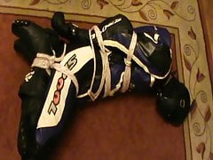 Hogtied bikerslave is muzzled