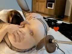 Submissive sissy gets anal penetration from massive black dildo machine