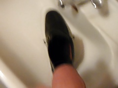 Piss in men's dress shoe