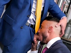 Wearing a suit and having office sex with a tall hunk