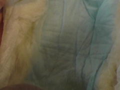 Lad overflows his nappy with a utter bladder