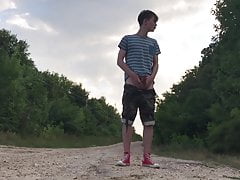 Teenager jerking off on a dusty road