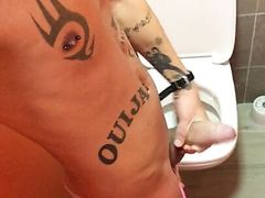 Horny at the waterpark toilet - barefoot in pink swim trunks