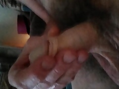 Stroking my limp penis.