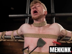 Kyler Drake makes Jesse Stone bite a gag as he drips hot wax over him