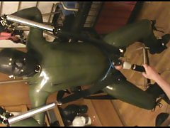 Green and green - swinged rubberslave gets a massage