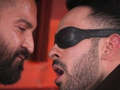 Blindfolded lad is deepthroating his hunky master