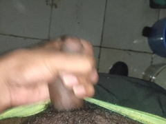 Young man tugging in the rest room