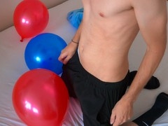 Guy in black socks pops balloons in a naughty way /// Jordan Wilder