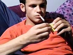 Horny jock fingers his ass and jerks off while smoking