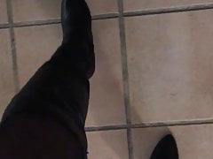 Walking naked wearing high heel boots