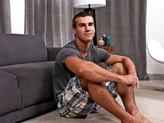 A good-looking guy with hairy legs unloads on the bed