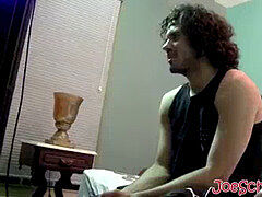 Handsome dude with curly dark-hued hair jerking off his large man rod