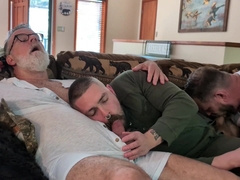 3 hunks on the couch liking each other from head to toes