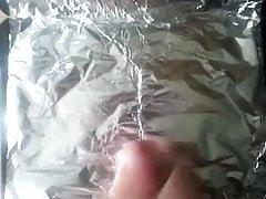 Shooting a huge load on tin foil for Cathy