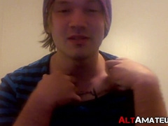 Tattooed punk jock jerking off his big throbbing cock solo