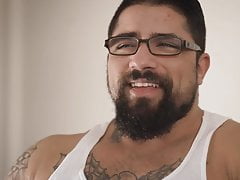 Ryan's cock is rock-hard as he stretches his balls
