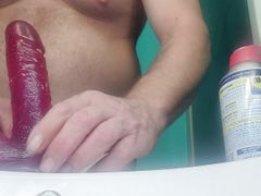 Fun with dildo on bathroom sink