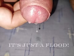 Slow motion flooding cumshot, cumming with a ball stretcher