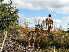 Naked berry picker shows off and jerks outdoor in the forest