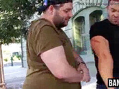 Burly deviant flexing alongside bear before battle