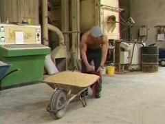 Construction hunks digging each other