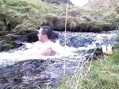 Hot guy spends and hour in a cold Scottish waterfall