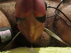Tied down cockcumshot closeup