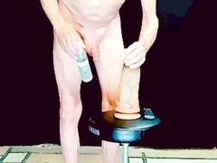 Just watch a sissy ride a huge dildo now