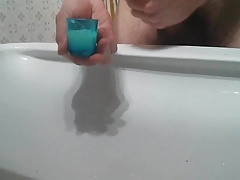 Filling a shotglass with cum 3