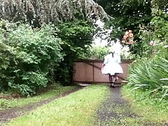 In a green maid outfit for a day's work in sewing