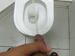 TEEN BOY PEEING IN TOILET.