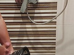 Playing in shower with combat boots