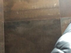 Pissing in a public bathroom