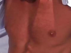 Gay hunks undress at the cinema for anal sex