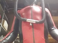 Latex catsuit and heavy rubber helmet