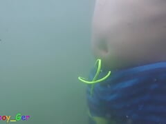 Jerking my big uncut cock underwater in a dirty lake