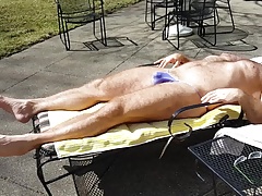Sunning in purple bikini